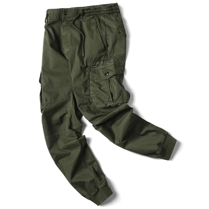 https://cdn.shopify.com/s/files/1/0878/4406/1529/files/VANGUARD-Langecargobroekvoorheren_5a11c76e-c2ad-4997-9ebb-fcff6820c9d8.jpg?v=1772202271