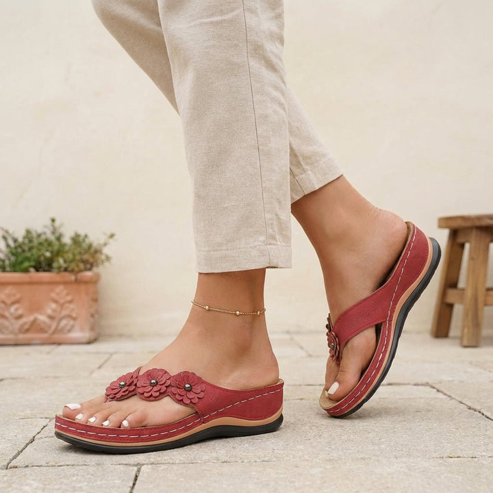 https://cdn.shopify.com/s/files/1/0878/4406/1529/files/orthopedic-flip-flops-floral-wedge-heel-comfort-sandals-1.jpg?v=1777503896